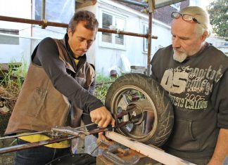 rolley Derby Sam Message and Neil Hemens bolt the axel to their trolley's frame