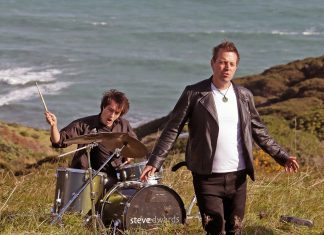 Steve shooting a video on top a pa site near Raglan. Photo Graham Hooper