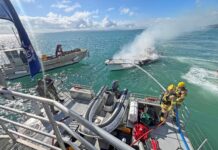 Ferries divert to assist burning launch