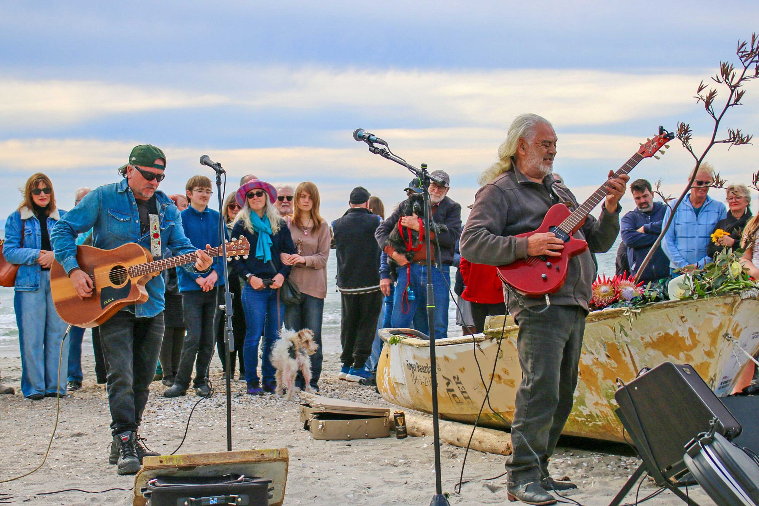 N-ROGER-Aaron-Carpenter-and-Mano-Pratt-played-Roger's-song-Gone-as-hundreds-gathered-around-his-boat-Fisherman's-Daughter-on-Saturday.-Photo-SG